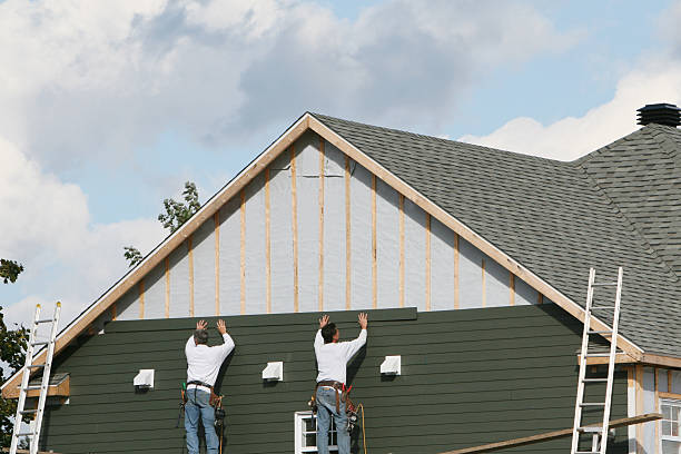 Professional Storm Damage Siding Repair technician working in Spencer, NC